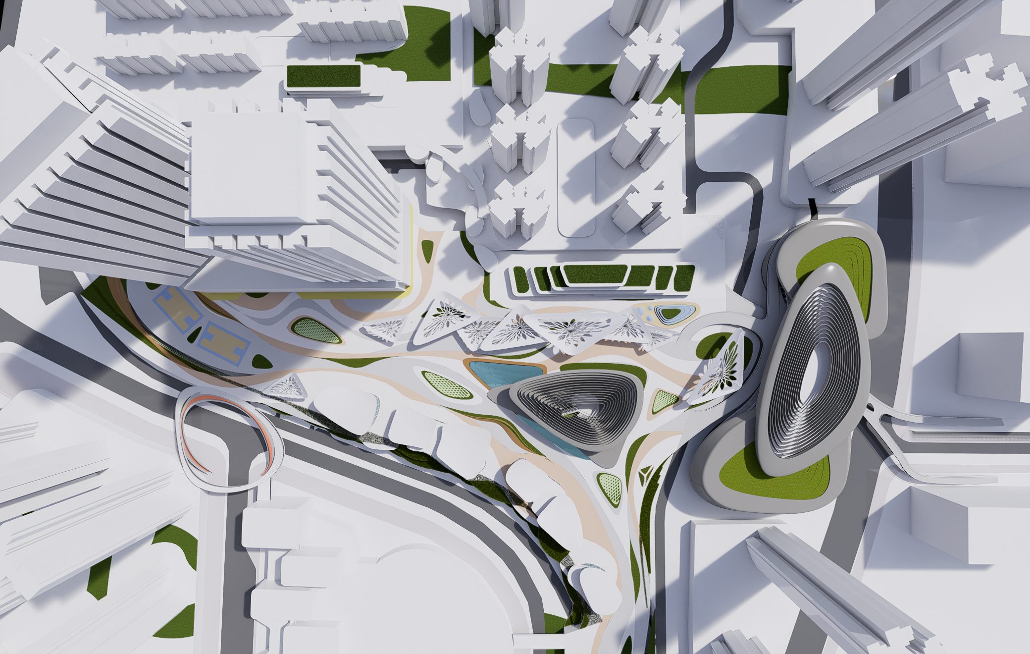 Site model seen from above: the main building’s rippled roof, a triangle of pavilions, the park and green corridor between housing blocks