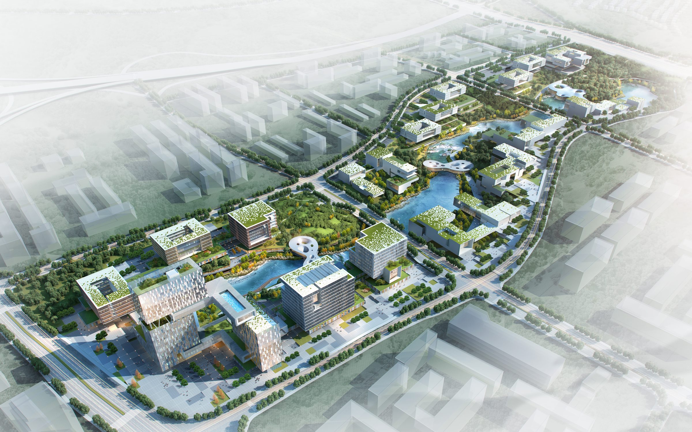 Aerial view of the office park: clusters of low buildings and green roofs on either side of a river that runs the length of the site