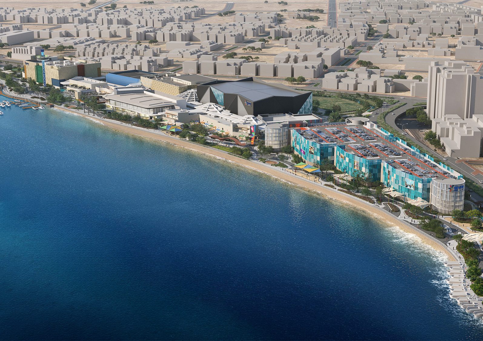 Aerial daytime view of the complex on the shoreline, the city beyond