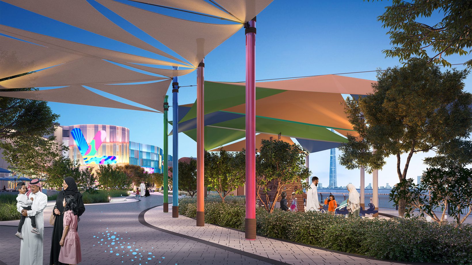 Shade sails on coloured posts over a landscaped walkway