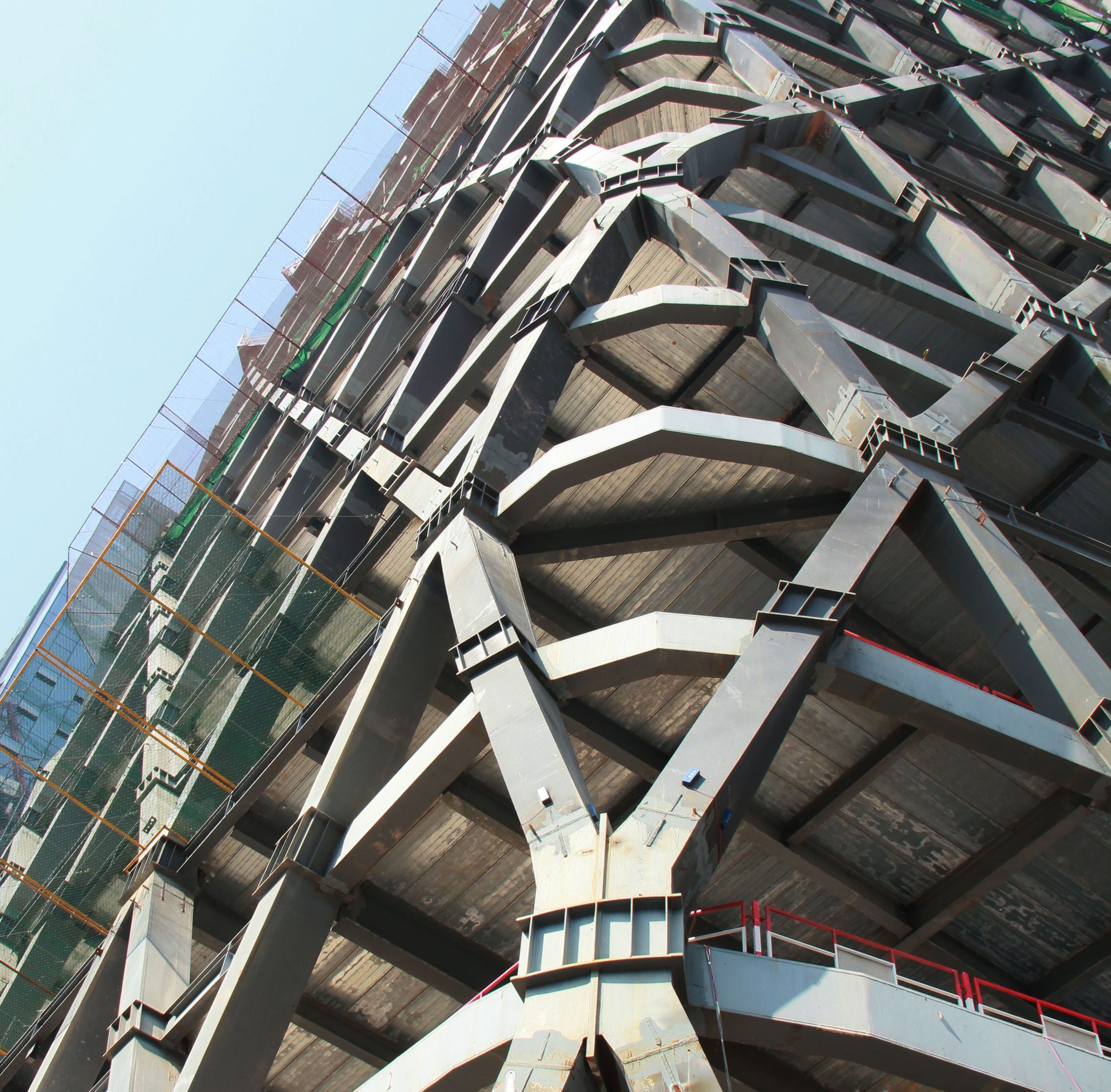 Construction photograph: steel diagrid members and floor edges before cladding