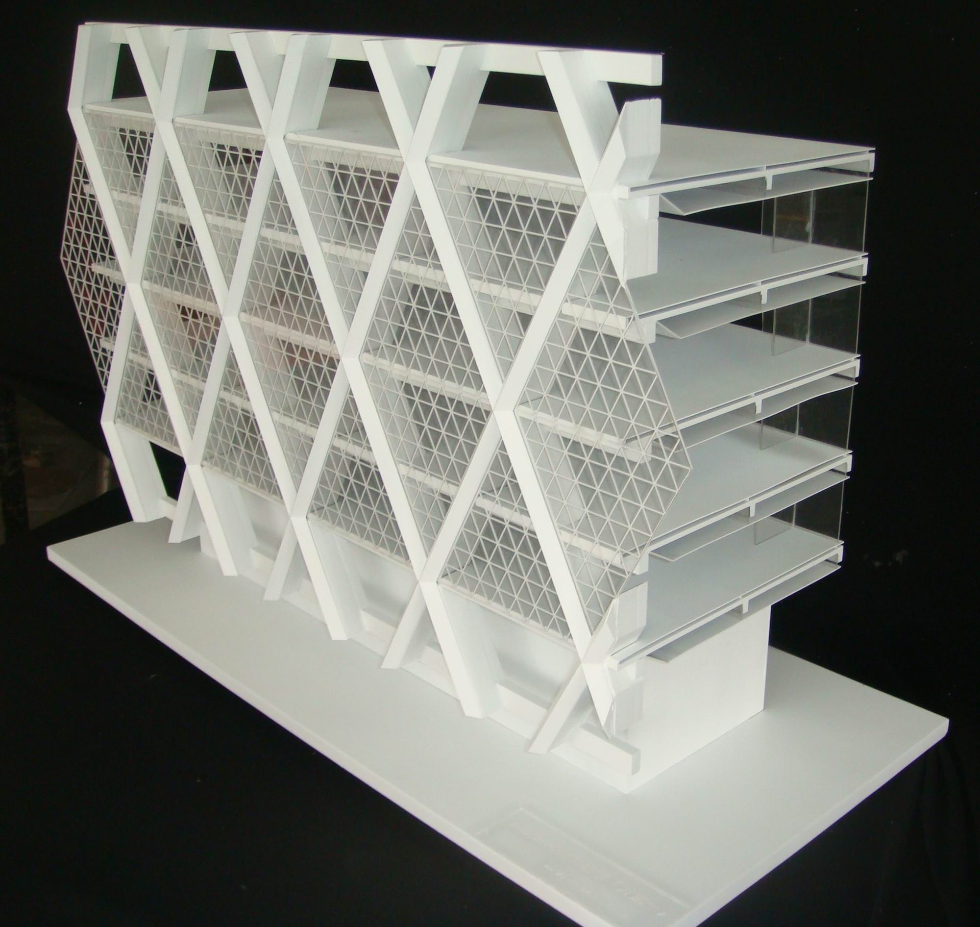 White study model of the diagrid module: diagonal members wrapping stacked floor plates